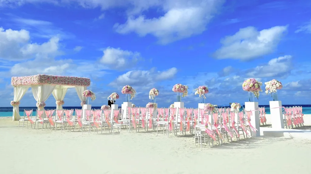 Beach gazebo with pink chairs