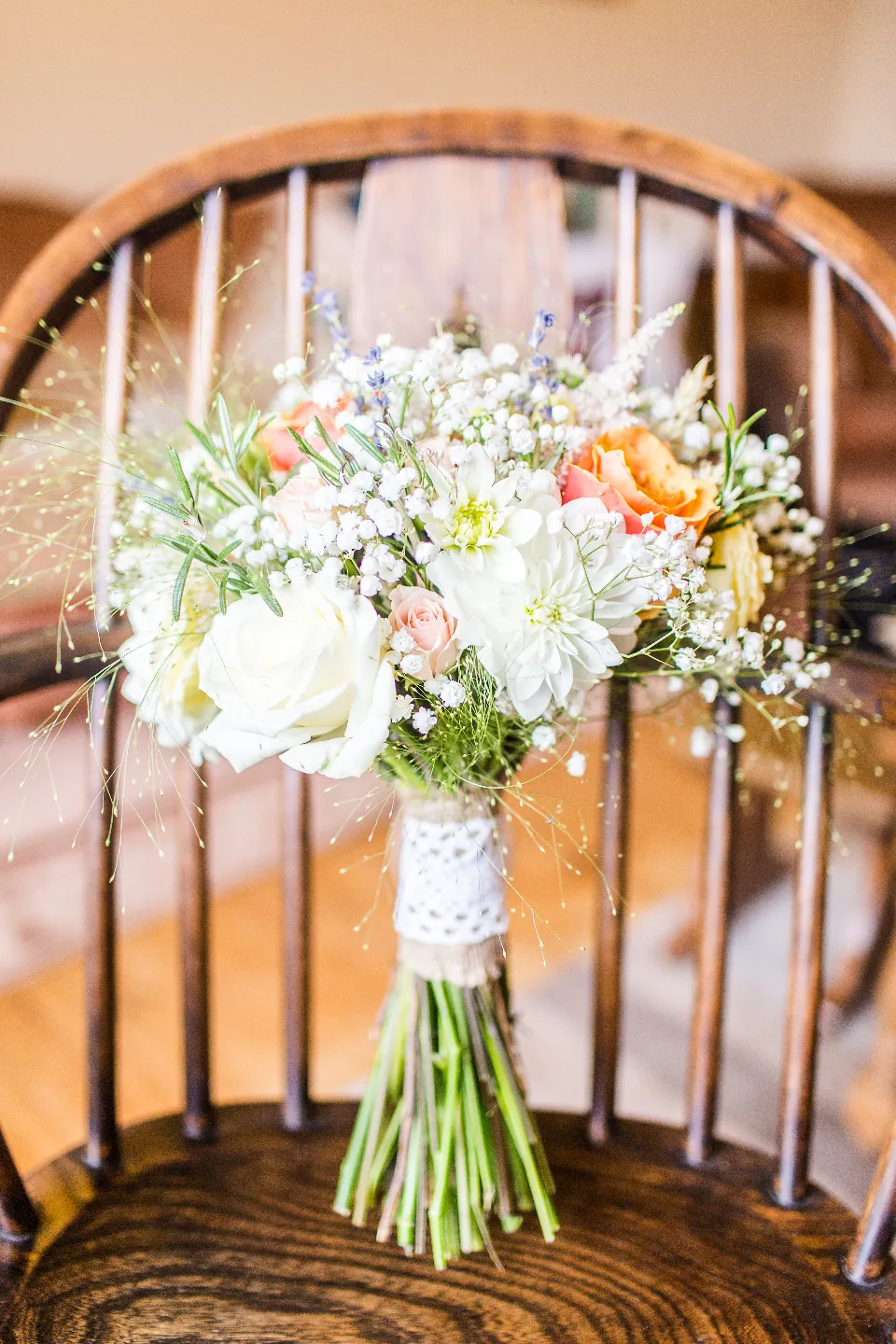 White garden bouquet resting on a chair