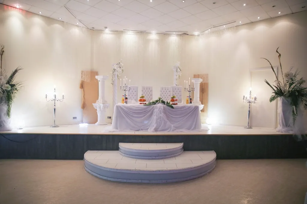 Wedding head table with white linens