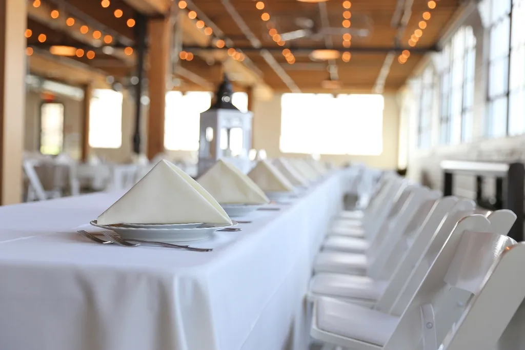 Long white tables in a loft